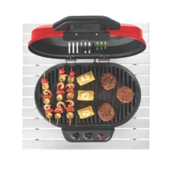 Coleman RoadTrip® 225 Portable Tabletop Propane Grill 14 Coleman RoadTrip® 225 Portable Tabletop Propane Grill -Camp And Explore 2000033047 coleman grills 225 TT heritage red flames turned on food on grates overhead 3